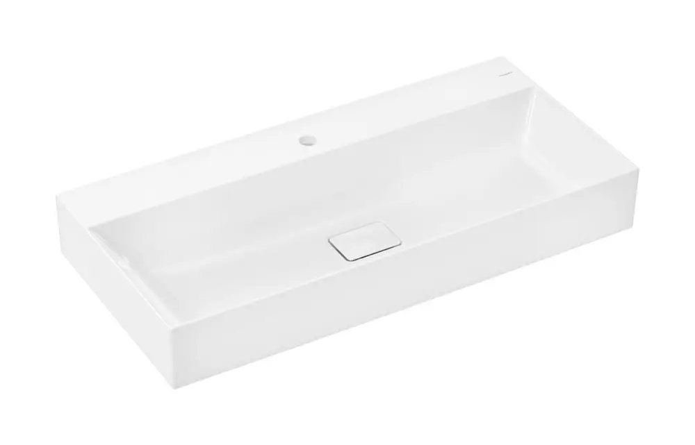 Weißes Waschtischmodell von Hansgrohe mit rechteckiger Form, einem Hahnloch in der Mitte und glatter Oberfläche ohne sichtbaren Überlauf.